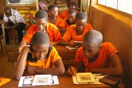 Ayenyah, Ghana primary-school students reading Curious George